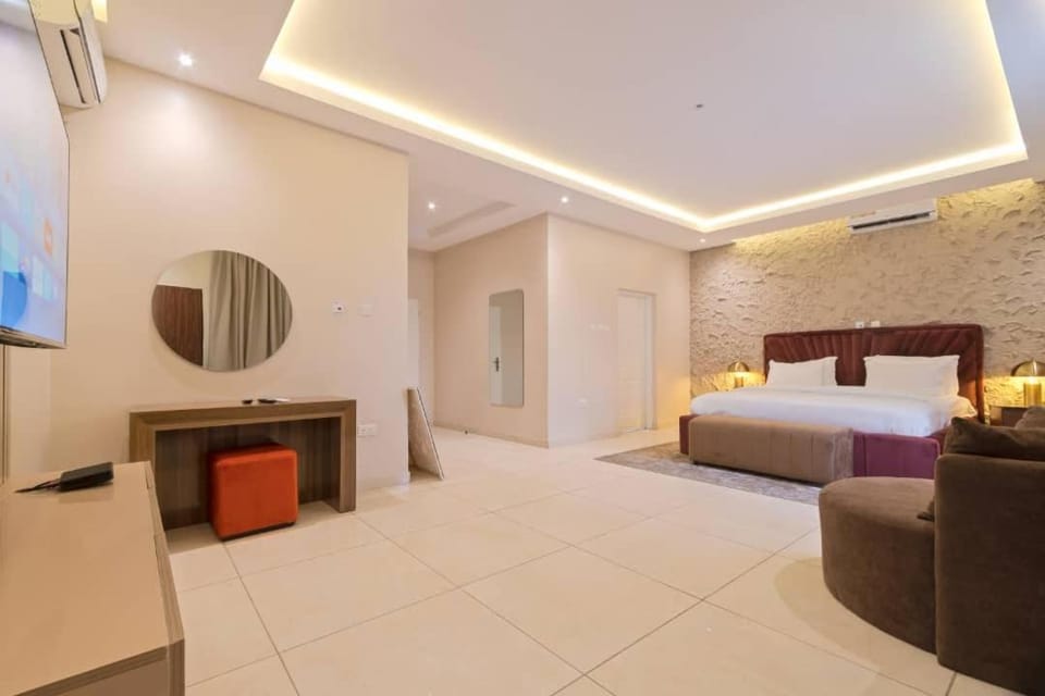Bed, TV and multimedia, Seating area, Bedroom, air conditioner