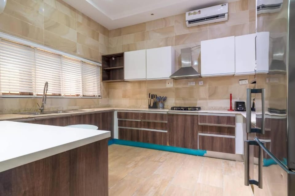 Kitchen or kitchenette, dishwasher, oven, stove