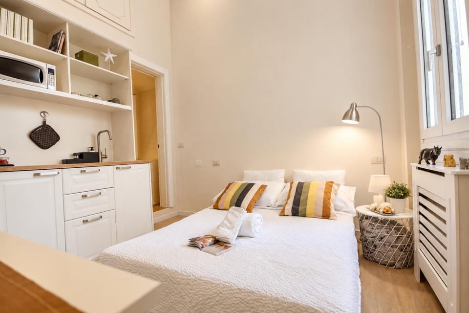 Bed, Photo of the whole room, Decorative detail, Bedroom, microwave, towels
