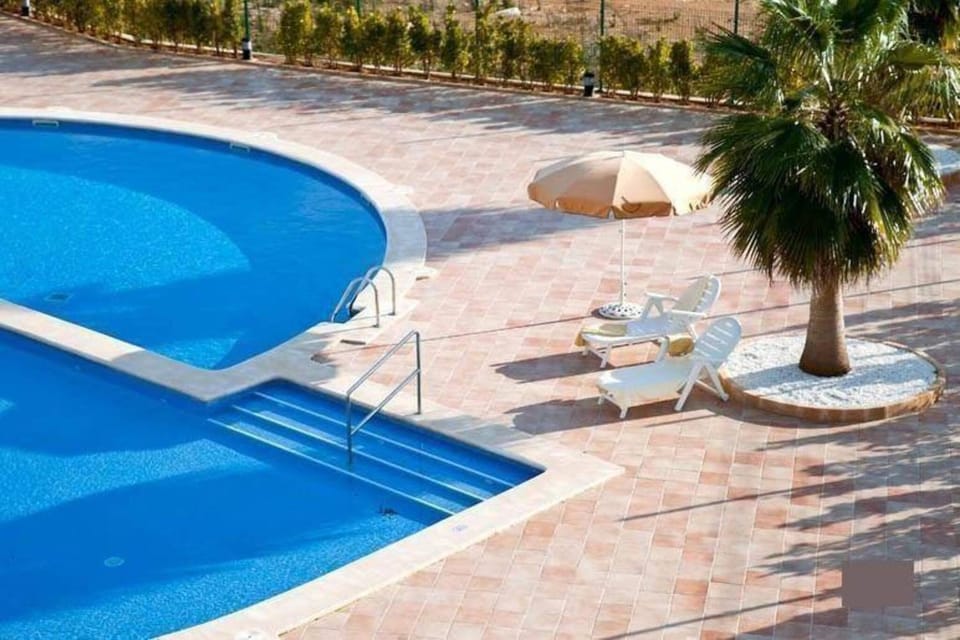 Property building, Living room, Swimming pool