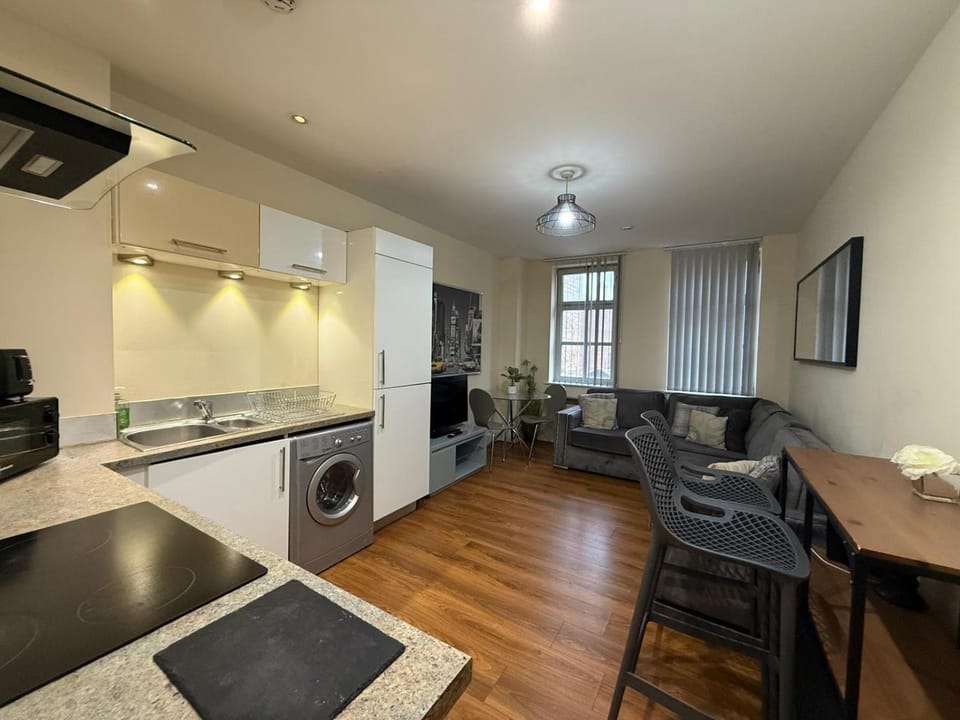 Kitchen or kitchenette, Living room, Seating area, Dining area, dishwasher, oven, stove, toaster