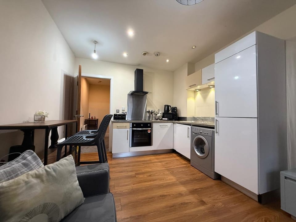 Kitchen or kitchenette, Dining area, dishwasher, stove, toaster, washing machine, dryer