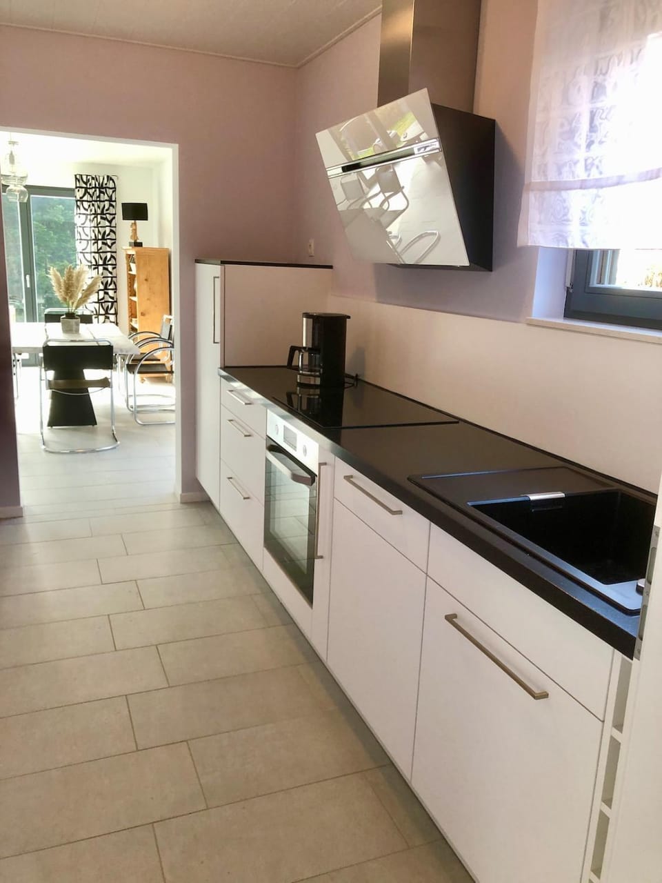 Kitchen or kitchenette, dishwasher, oven, stove