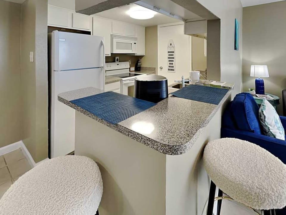 Kitchen or kitchenette, Living room, Seating area, furniture, microwave
