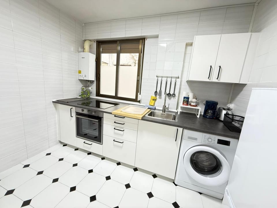 Kitchen or kitchenette, washing machine