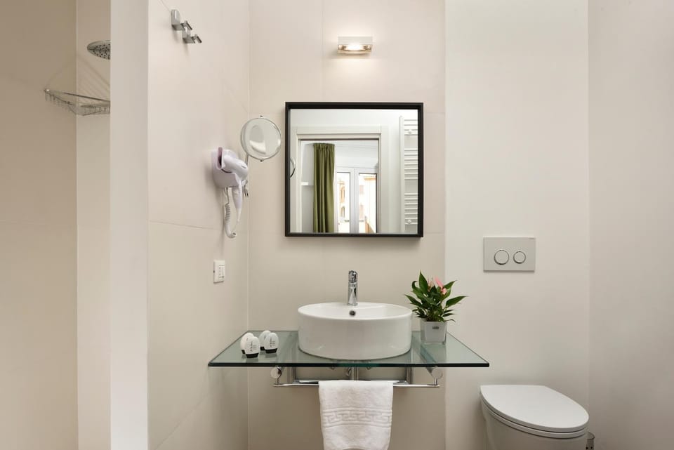 Toilet, Bathroom, bidet, hair dryier, towels