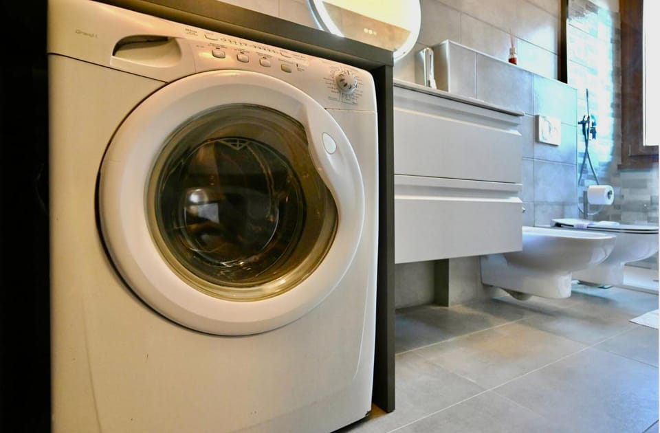 Shower, hair dryier, towels, washing machine
