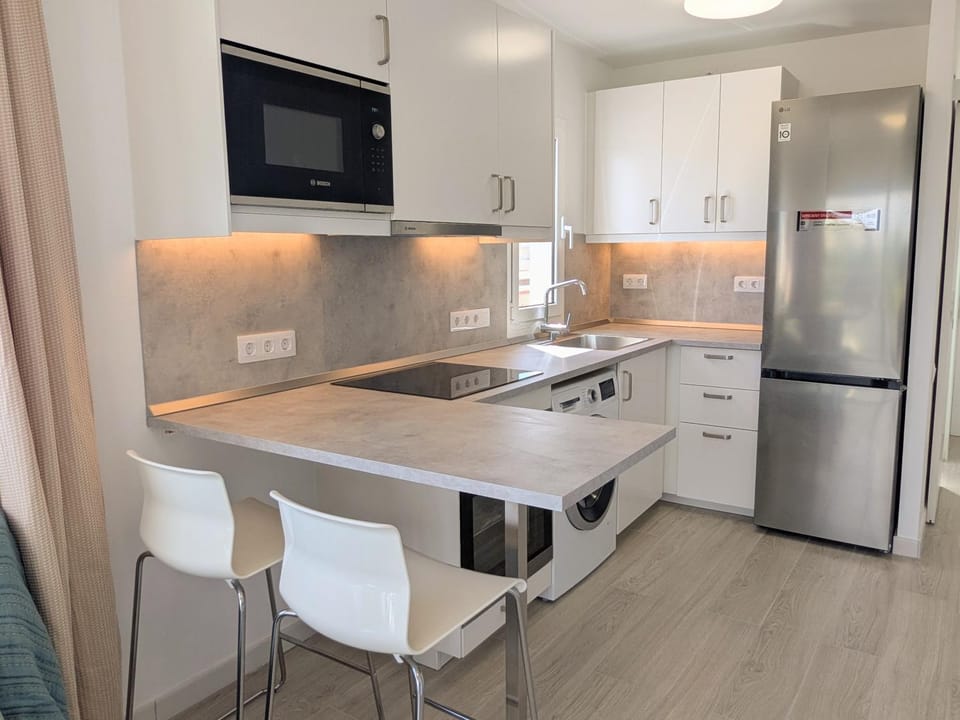 Kitchen or kitchenette, Dining area, oven, stove, washing machine, kitchen