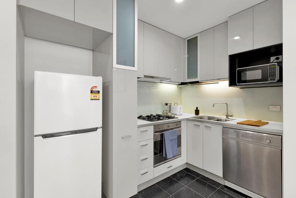 Kitchen or kitchenette, dishwasher, oven, stove, toaster
