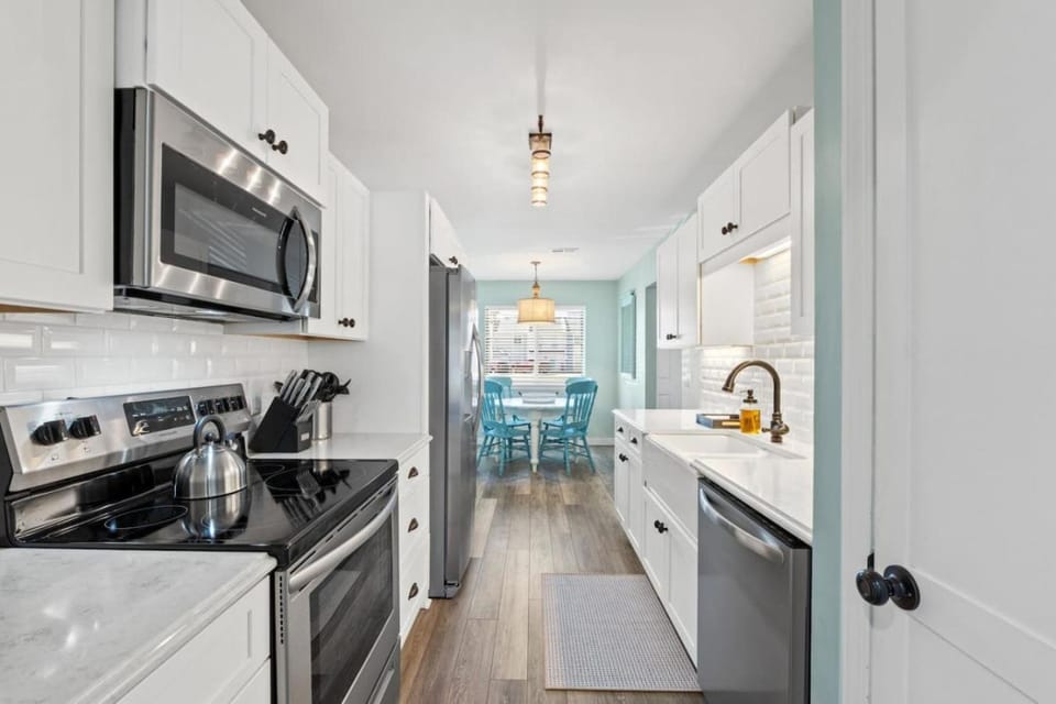 Kitchen or kitchenette, dishwasher, oven, stove