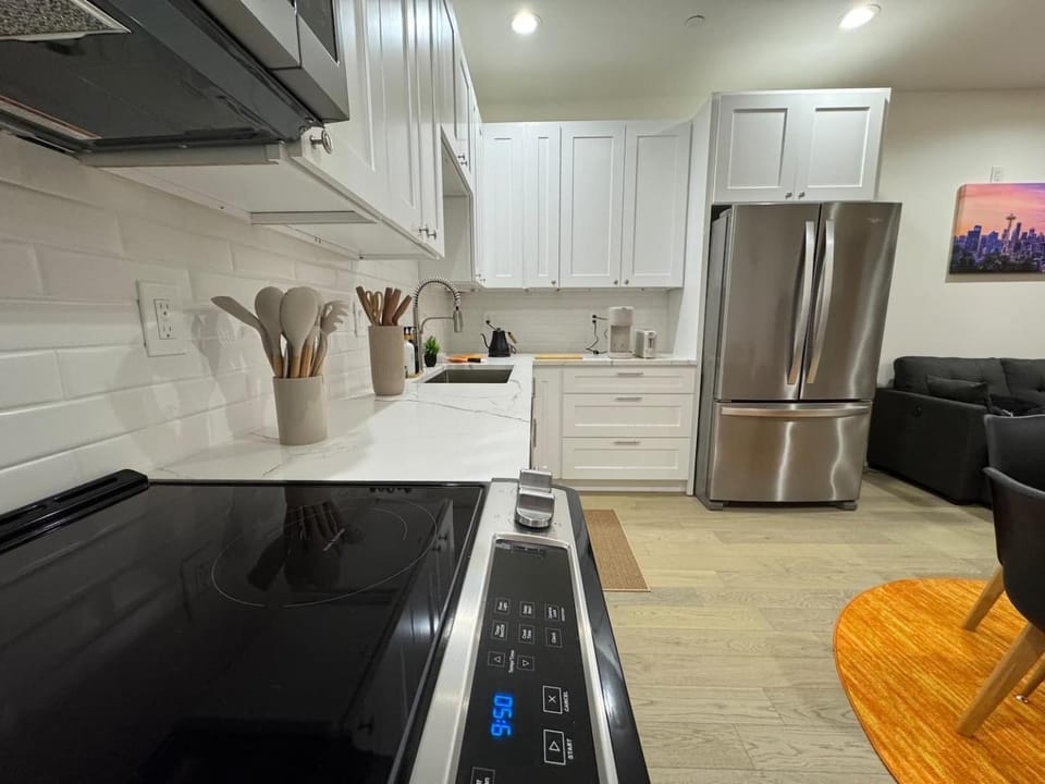 Kitchen or kitchenette, dishwasher, oven, stove
