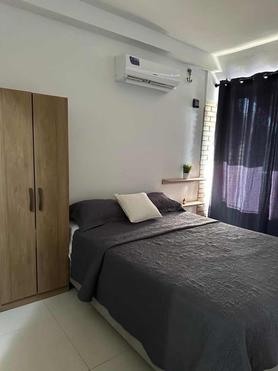 Bed, wardrobe, air conditioner