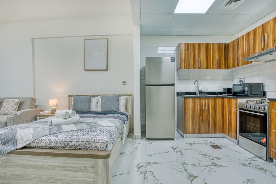 Kitchen or kitchenette, oven, stove, towels