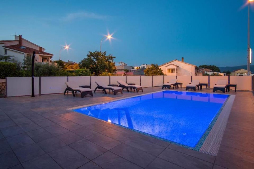 Patio, Night, Pool view, Swimming pool, sunbed