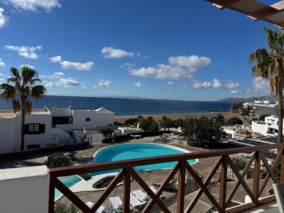 View (from property/room), Balcony/Terrace, Pool view, Sea view