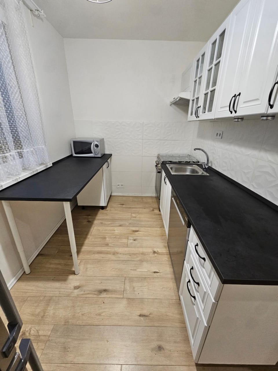 Kitchen or kitchenette, dishwasher, microwave