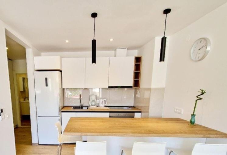 Kitchen or kitchenette, dishwasher, oven, stove