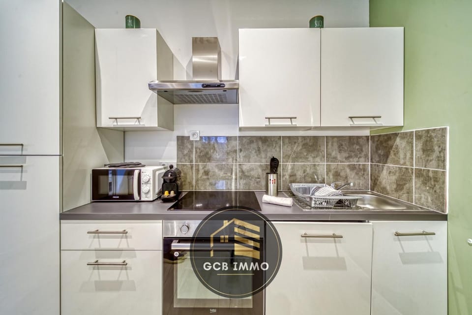Kitchen or kitchenette, dishwasher, oven, stove