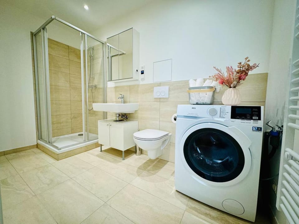 Shower, Toilet, Bathroom, towels, washing machine, dryer