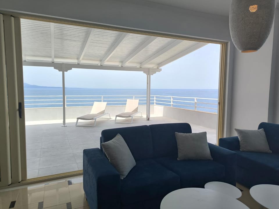 View (from property/room), Balcony/Terrace, Living room, Seating area, Beach, Sea view