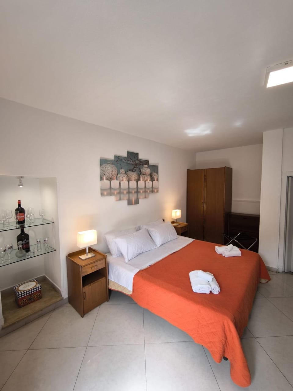 Bed, towels, wardrobe