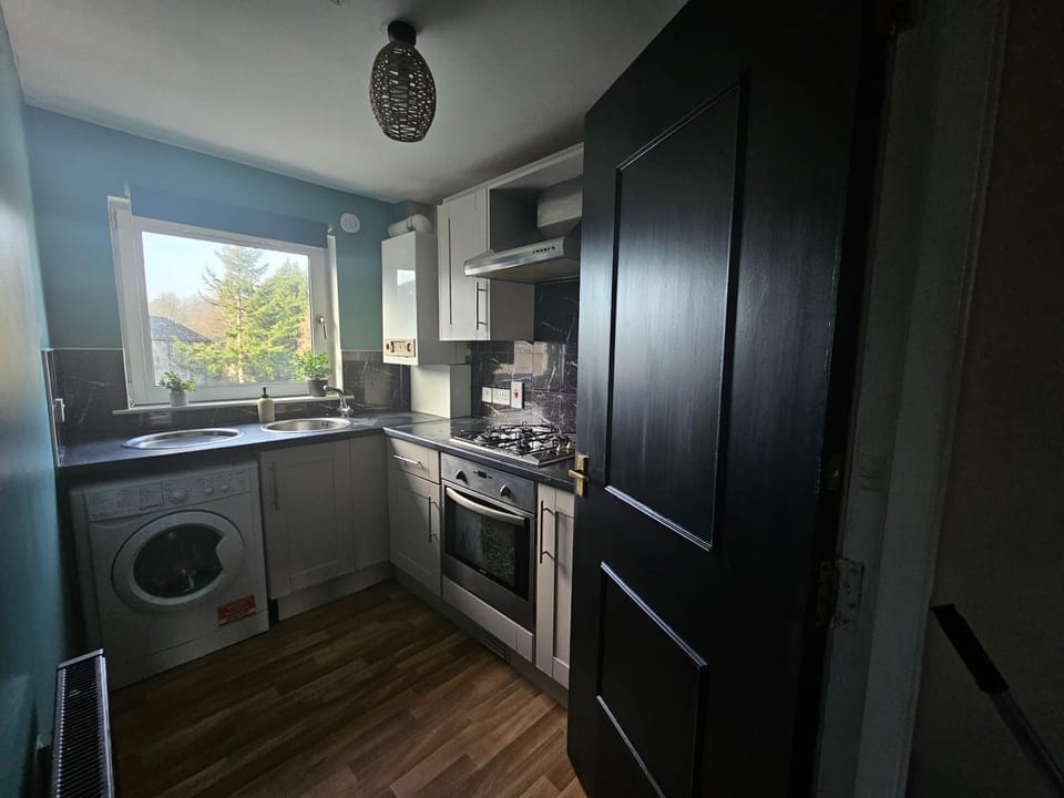 Kitchen or kitchenette, oven, stove, washing machine, dryer