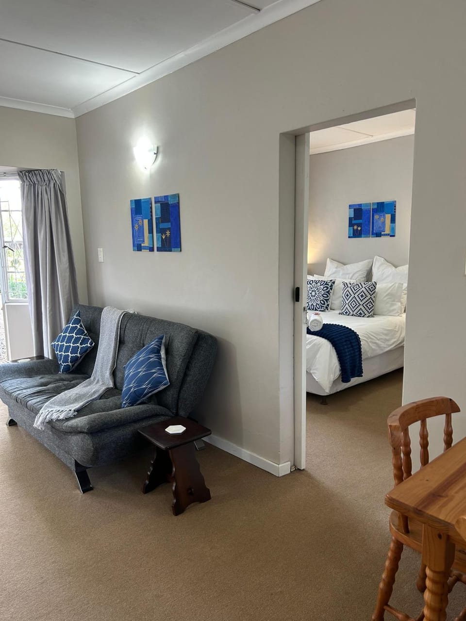 Bed, Living room, Seating area, Bedroom