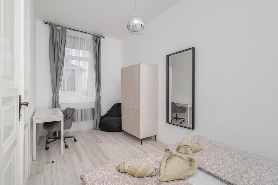 Seating area, towels, wardrobe