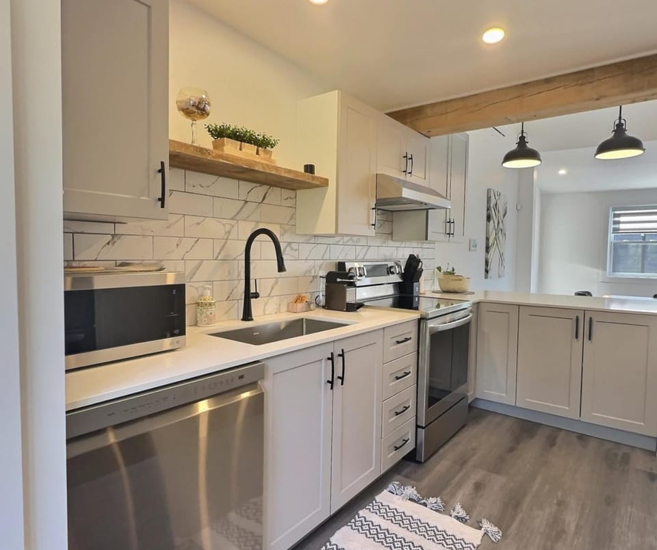 Kitchen or kitchenette, dishwasher, oven, stove, toaster