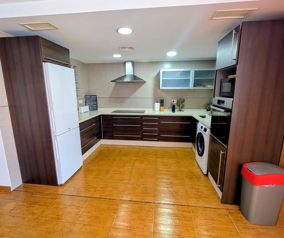 Kitchen or kitchenette, oven, stove, washing machine