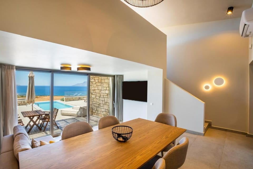 Living room, Dining area, Pool view, Sea view