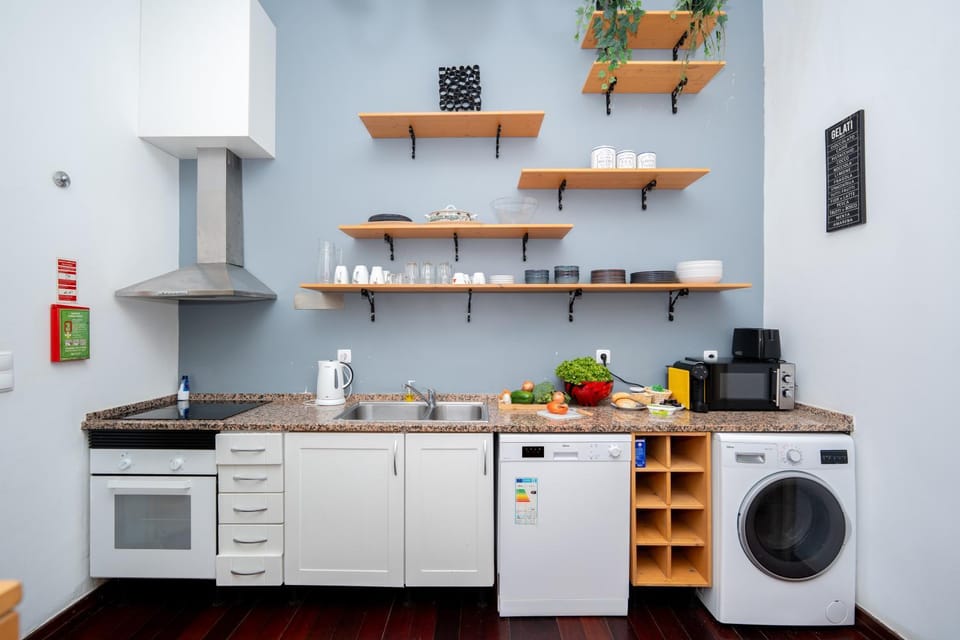 Kitchen or kitchenette, dishwasher, oven, stove, washing machine
