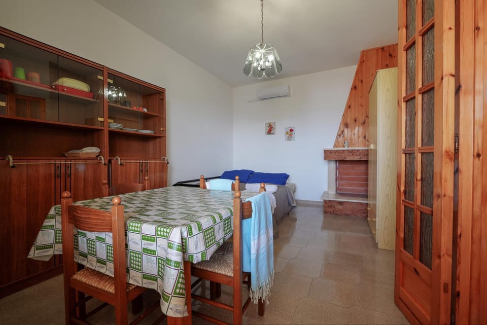 Bed, Living room, Seating area, Bedroom