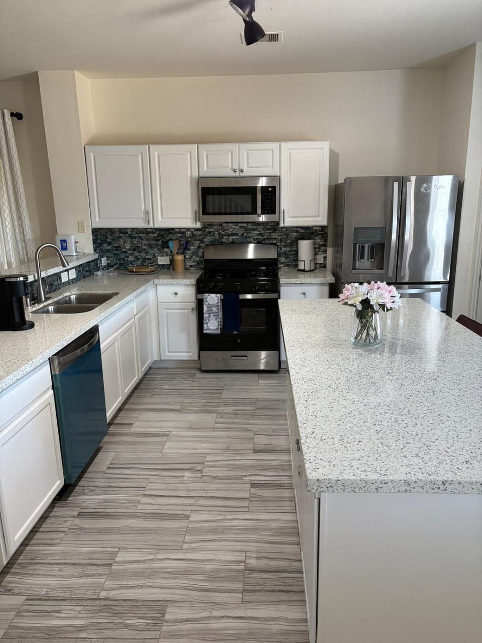 Kitchen or kitchenette, dishwasher, oven, stove, toaster
