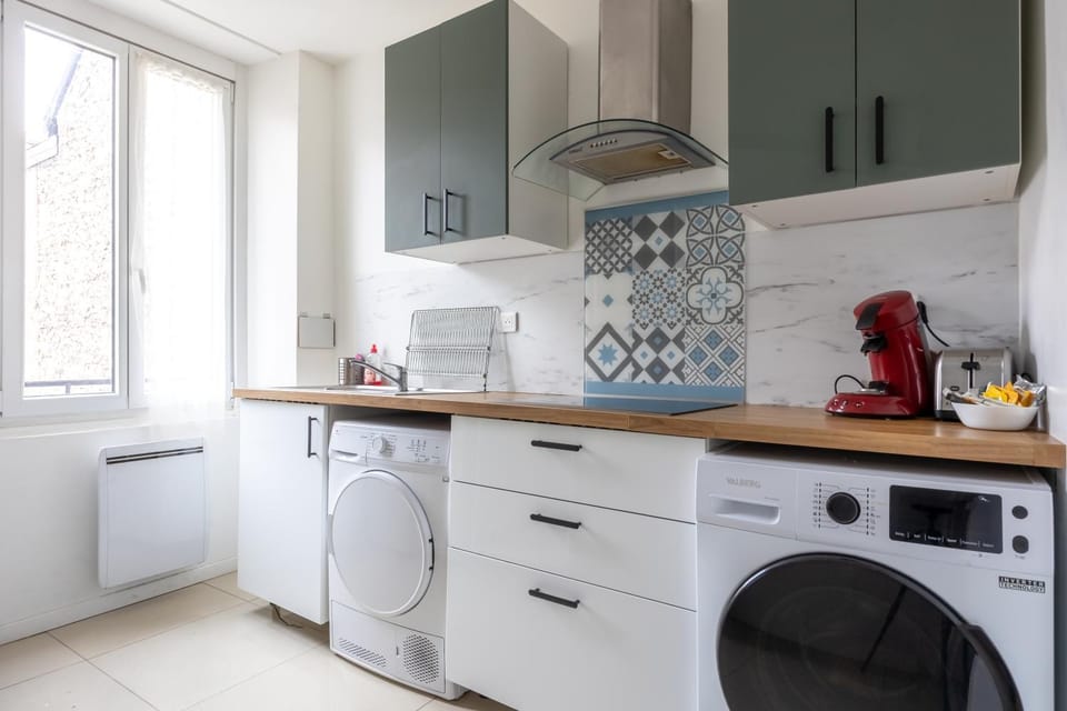 Kitchen or kitchenette, oven, stove, toaster, washing machine, dryer