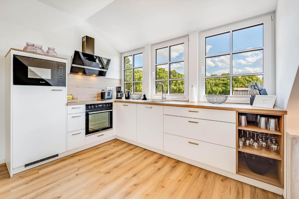 Kitchen or kitchenette, dishwasher, oven, stove