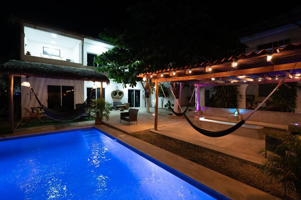 Property building, Patio, Night, Pool view, Swimming pool, sunbed