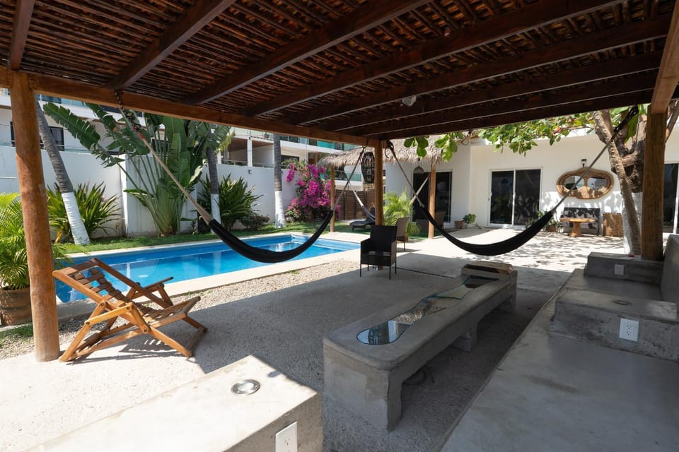 Patio, Day, Natural landscape, Living room, Seating area, Pool view, Swimming pool, sunbed