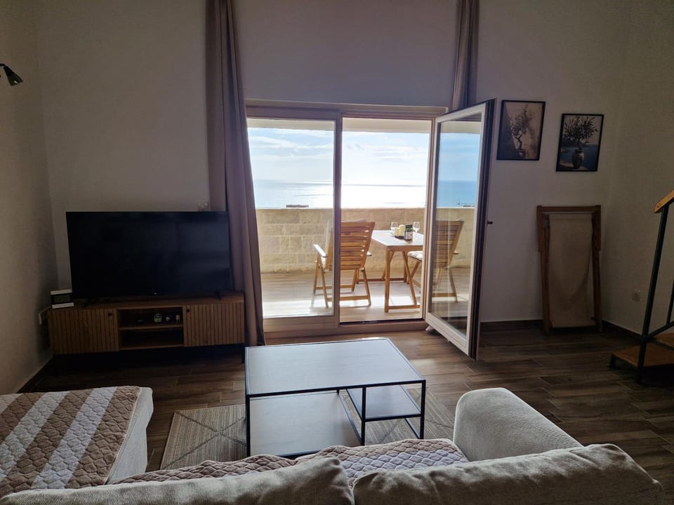 Natural landscape, Living room, Seating area, Sea view