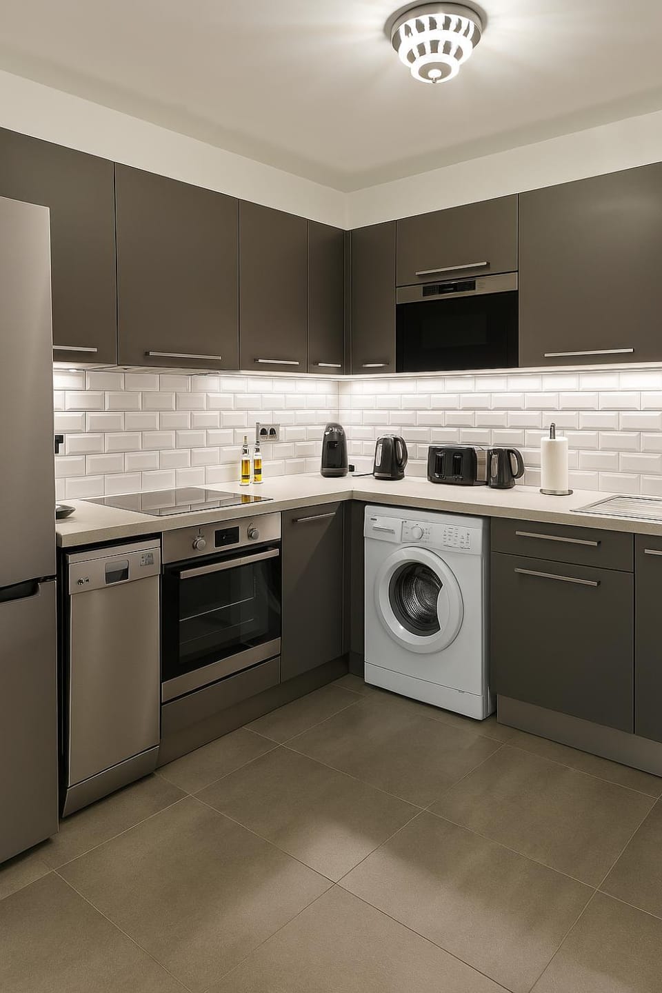 Kitchen or kitchenette, dishwasher, oven, stove, toaster, washing machine
