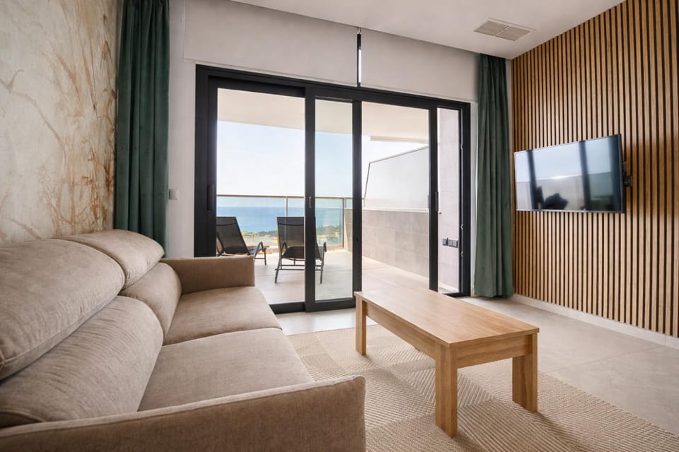 Activities, TV and multimedia, View (from property/room), Living room, Seating area, Evening entertainment, Sea view