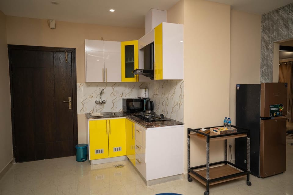 Kitchen or kitchenette, microwave, stove, toaster, kitchen