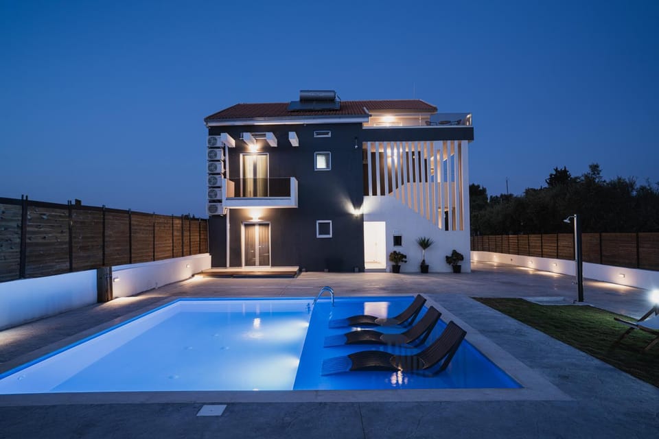 Property building, Patio, Night, Pool view, Swimming pool, sunbed