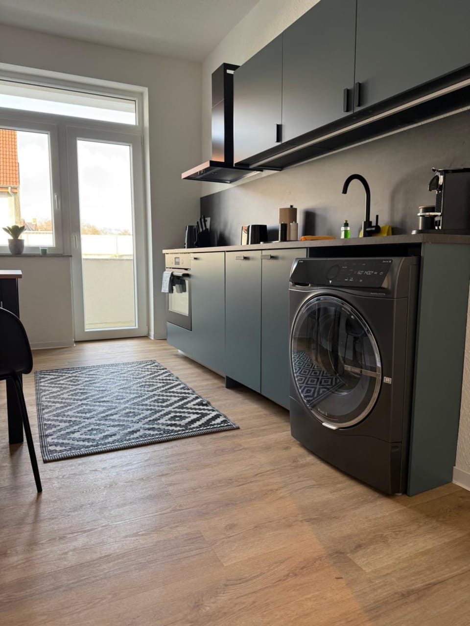Kitchen or kitchenette, dishwasher, stove, washing machine, dryer
