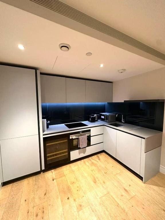 Kitchen or kitchenette, dishwasher, oven, stove