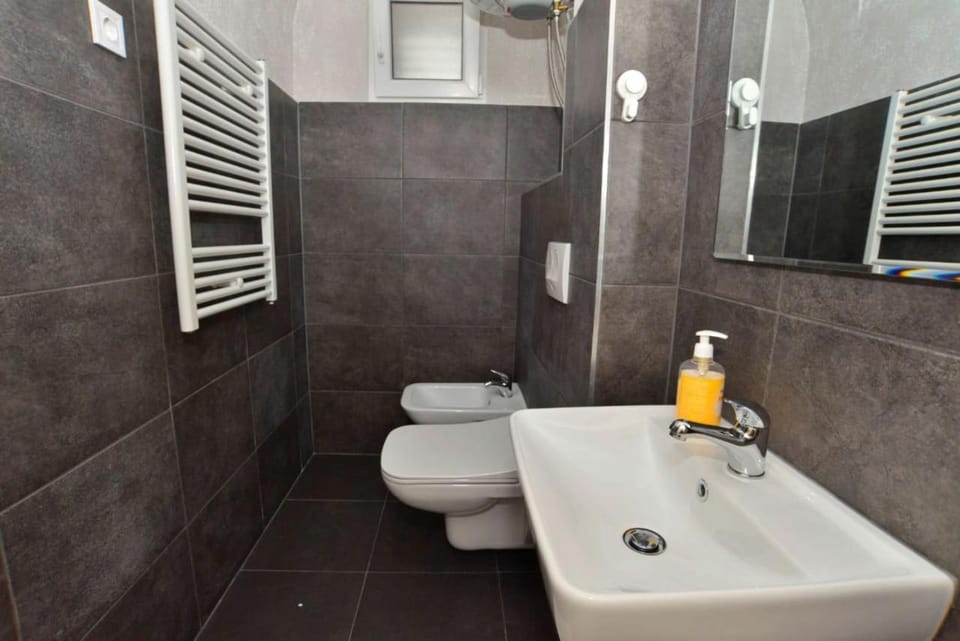 Bathroom, bidet, towels