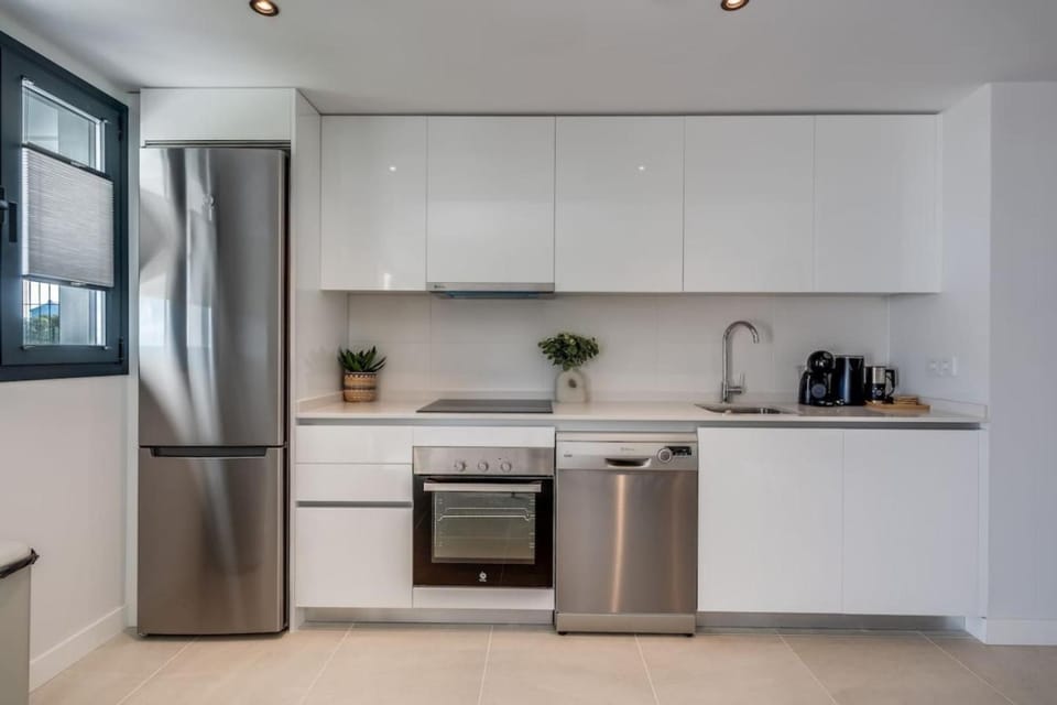 Kitchen or kitchenette, dishwasher, oven, stove, toaster