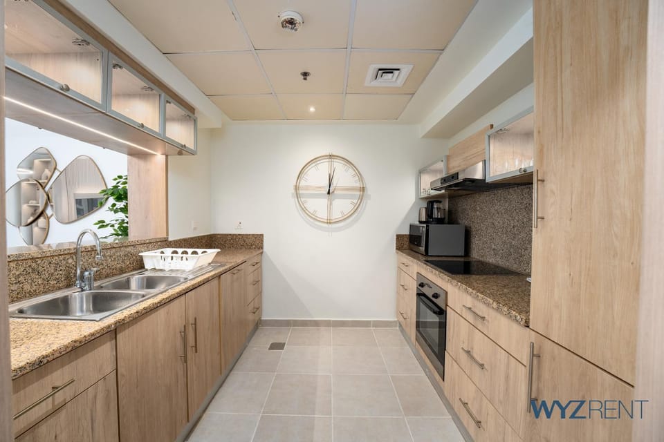 Kitchen or kitchenette, dishwasher, oven, stove
