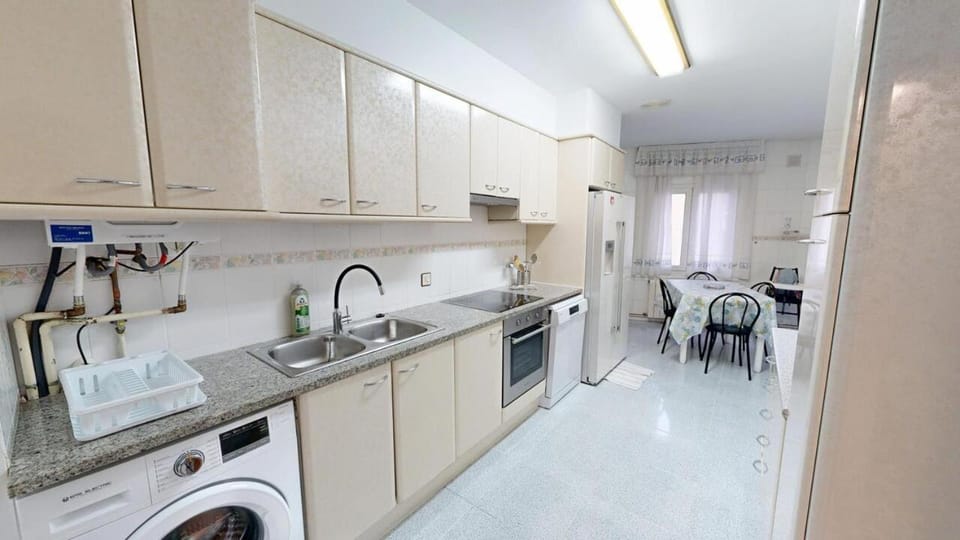 Kitchen or kitchenette, dishwasher, oven, stove, washing machine