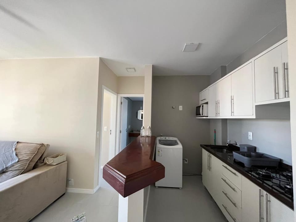 Kitchen or kitchenette, microwave, stove, washing machine